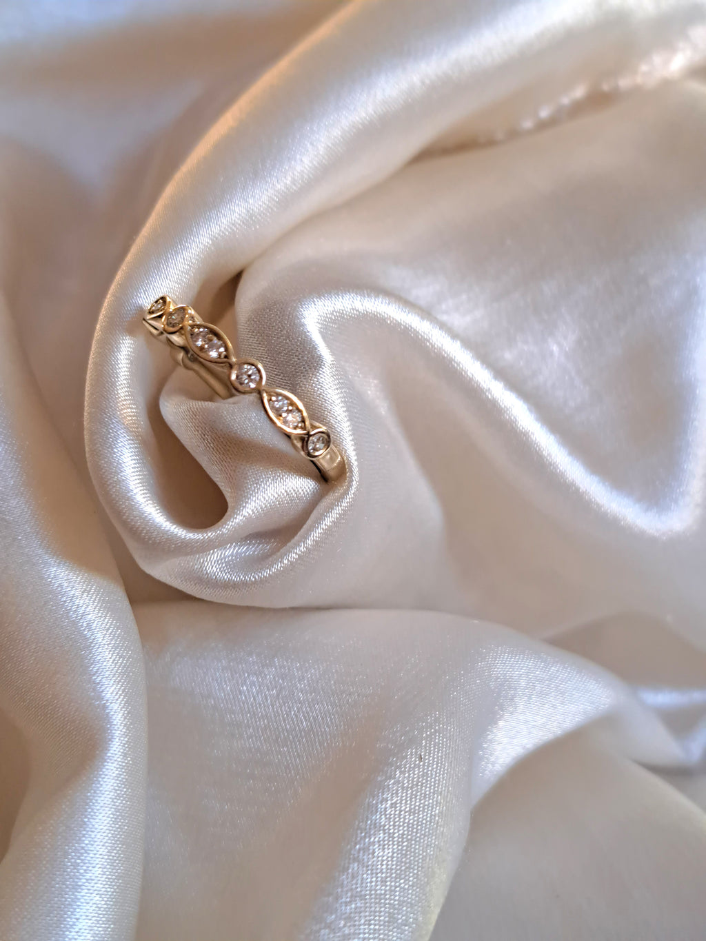2mm Round diamond and 1.3mm round diamond half eternity band.