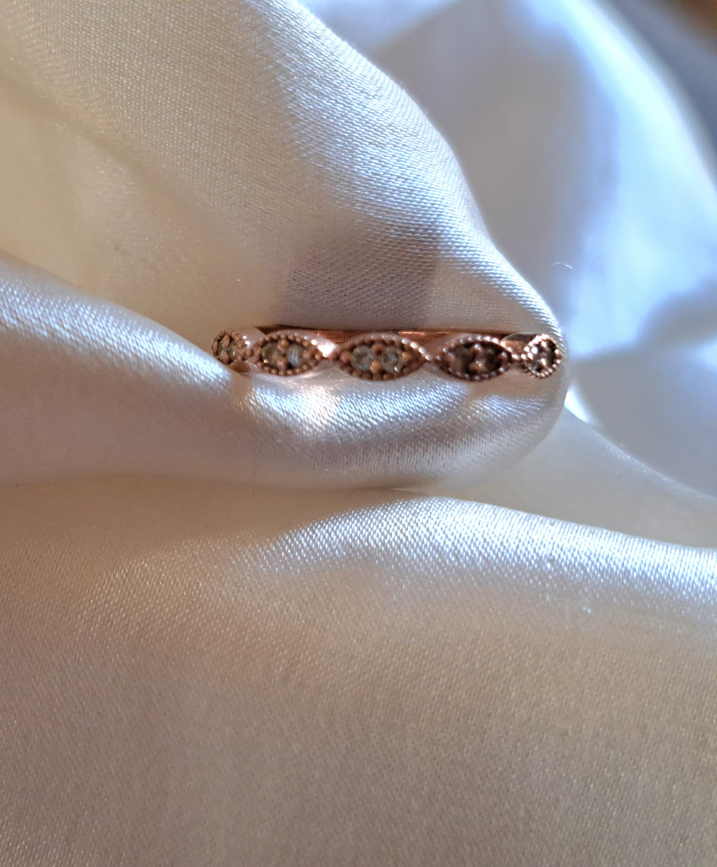 1.3mm round diamond scollop half eternity band.