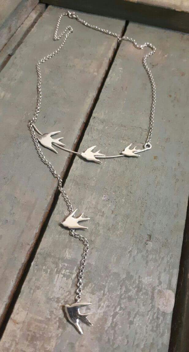 Silver necklace with 5 swallows, total length 55cm.

Please note all pieces are made on order by Erfdeel Juwele. Allow up to two weeks for manufacture when placing an order. 


