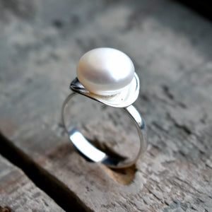 Pearl in silver concave cup ring