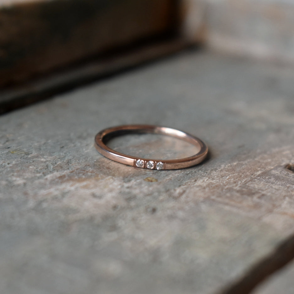 1.3mm 9ct gold band set with 3 small diamonds.

All pieces are made on order by Erfdeel Juwele. Please allow up to two weeks for manufacture when placing an order. 

