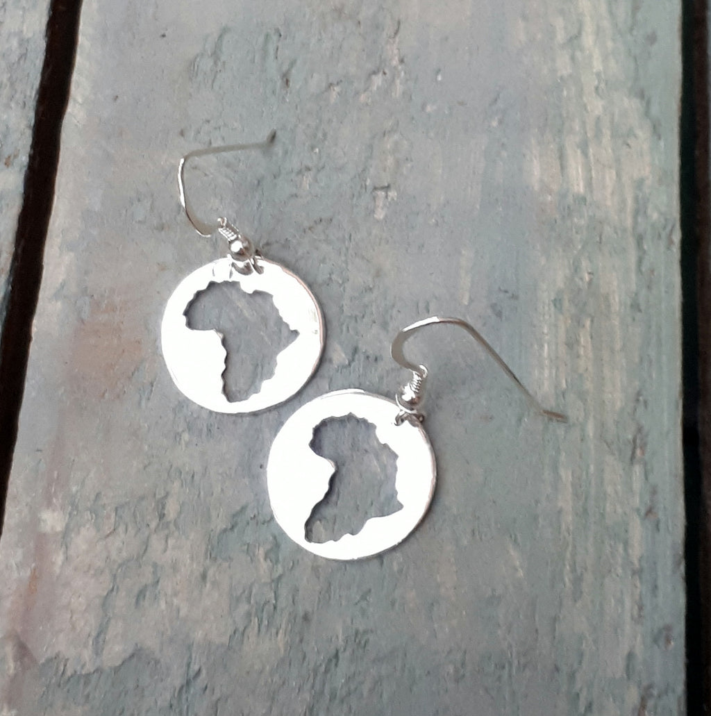 Sterling silver Africa silhouette hand pierced in an 18 mm disc. 