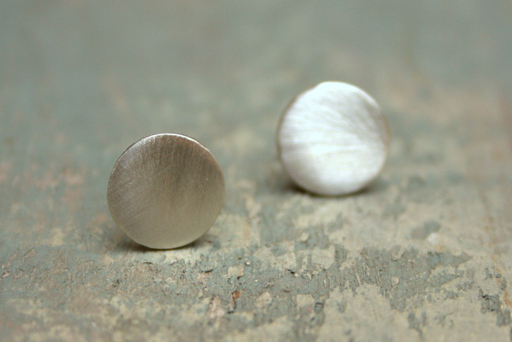 Sterling silver disc studs available in a 12mm or 16mm disc with a polished or matt finish.  Please note all pieces are made on order by Erfdeel Juwele. Allow up to a week for manufacture.