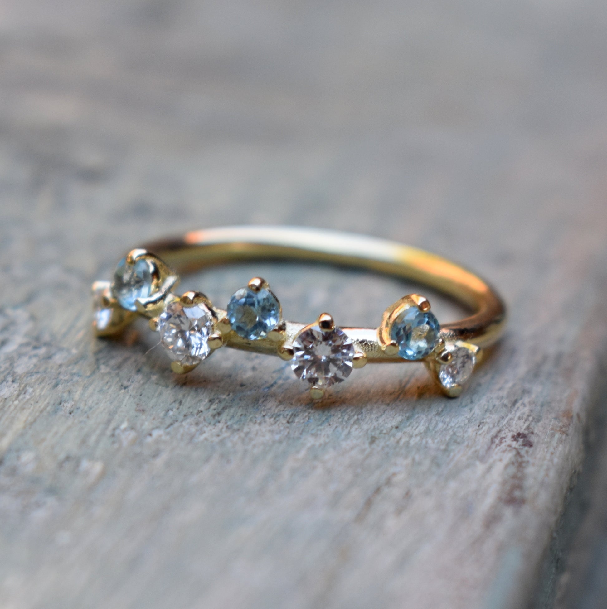 3 2.5mm Sky Topaz, 2 0.1ct and 2 0.03ct I/J brilliant diamonds set in 9ct yellow gold.  Please note all pieces are made on order by Erfdeel Juwele. Allow up to 2 weeks for manufacture.  Contact us for a quote on other metal and stone options.