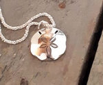Sterling silver pansy shell pendant.  The price does not include a chain. Chains need to be ordered separately. The chain in the image is a disco chain, available in our chains collection.  Please note that all pieces are made on order by Erfdeel Handgemaakte Juwele. Kindly allow up to two weeks for manufacture.