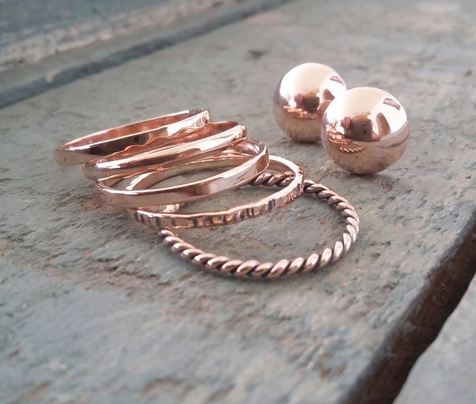 9ct Rosegold stack rings. Each band is more or less 2mm wide. Prices are per ring.  In photo from top left to bottom right:  1 Hammered texture 2 D-shape 3 Flat band 3 Line textured 4 Twisted wire Please note that all pieces are handmade on order by Erfdeel Juwele. Allow up to two weeks for manufacture.